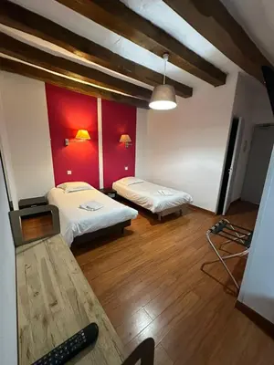 Un ou plusieurs lits dans un hébergement de l'établissement Maison de ville idéale pour groupes et familles