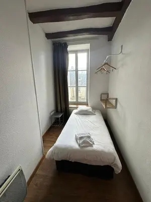 Un ou plusieurs lits dans un hébergement de l'établissement Maison de ville idéale pour groupes et familles