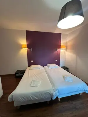 Un ou plusieurs lits dans un hébergement de l'établissement Maison de ville idéale pour groupes et familles