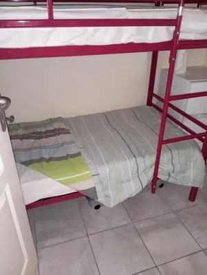 Un ou plusieurs lits dans un hébergement de l'établissement Chez Caro