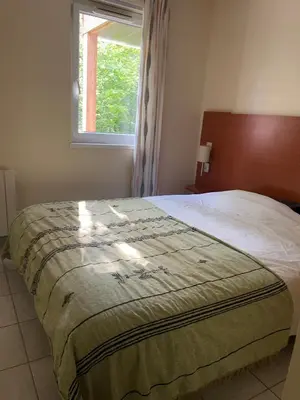 Un ou plusieurs lits dans un hébergement de l'établissement Chez Caro