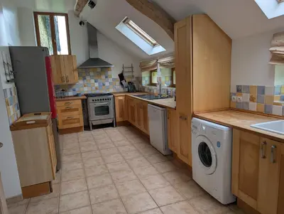 Cuisine ou kitchenette dans l'établissement Les Hiboux