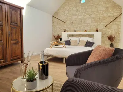 Coin salon dans l'établissement Domaine Les Chauveaux, 3 gites, 26 personnes, 1 salle