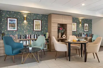 Coin salon dans l'établissement Quality Aparthotel Saumur