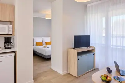 Un ou plusieurs lits dans un hébergement de l'établissement Quality Aparthotel Saumur