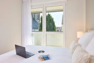 Un ou plusieurs lits dans un hébergement de l'établissement Quality Aparthotel Saumur