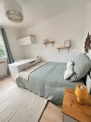 Un ou plusieurs lits dans un hébergement de l'établissement Appartement 6 chambres