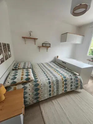 Un ou plusieurs lits dans un hébergement de l'établissement Appartement 6 chambres