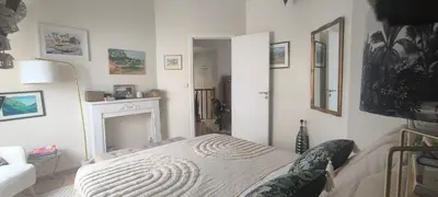 Un ou plusieurs lits dans un hébergement de l'établissement Maison moderne 150 m2 à 15mn du centre ville