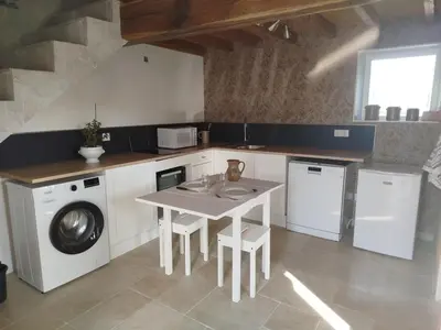 Cuisine ou kitchenette dans l'établissement Le Cris Lo