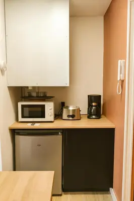 Cuisine ou kitchenette dans l'établissement Lumineux T2, 2 pers, jardin & terrasse au calme