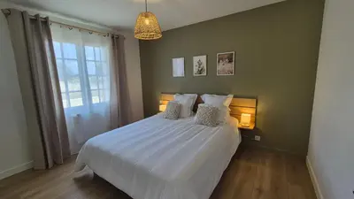 Un ou plusieurs lits dans un hébergement de l'établissement Gîte Au Cœur des Châteaux