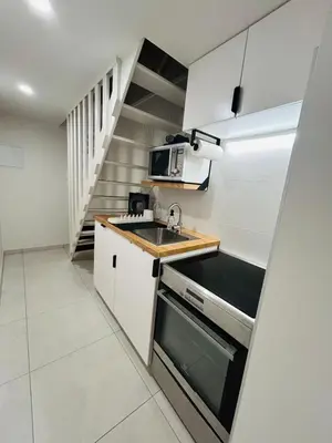 Cuisine ou kitchenette dans l'établissement GÎTE Au 21 Loveroom
