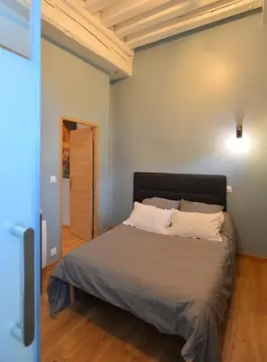 Un ou plusieurs lits dans un hébergement de l'établissement Appartement coeur de ville