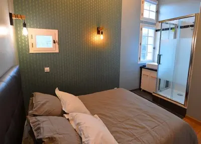Un ou plusieurs lits dans un hébergement de l'établissement Appartement coeur de ville
