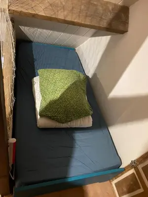 Un ou plusieurs lits dans un hébergement de l'établissement Grange de caractère avec cour privée
