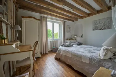 Un ou plusieurs lits dans un hébergement de l'établissement Chambres d'hôtes Le Theil