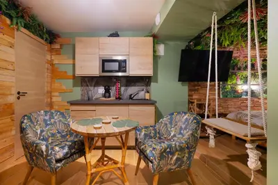 Cuisine ou kitchenette dans l'établissement Suite jungle amour détente
