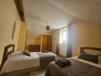 Un ou plusieurs lits dans un hébergement de l'établissement Gîtes du Château de Malcombe