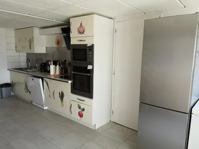 Cuisine ou kitchenette dans l'établissement La Villa
