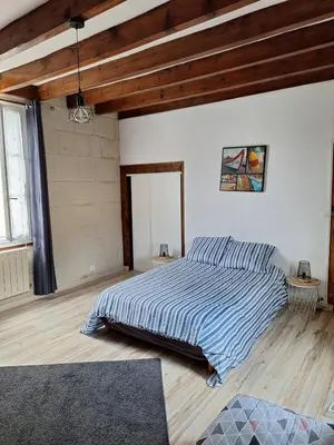 Un ou plusieurs lits dans un hébergement de l'établissement Maison Cosy Saumur