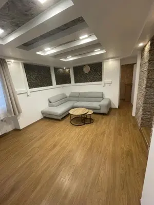 Coin salon dans l'établissement Charmante Apartment