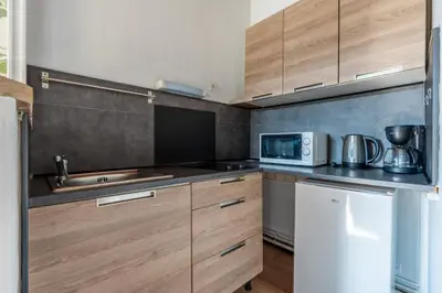 Cuisine ou kitchenette dans l'établissement Le Cap Blésois - Hyper centre
