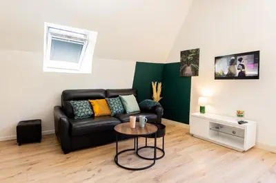 Coin salon dans l'établissement Mirabeau Sous Les Toits 2 - Tours