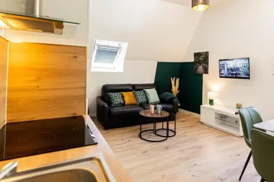 Coin salon dans l'établissement Mirabeau Sous Les Toits 2 - Tours