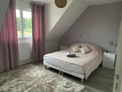 Un ou plusieurs lits dans un hébergement de l'établissement Maison récente à 15 minutes du circuit des 24 heures du Mans