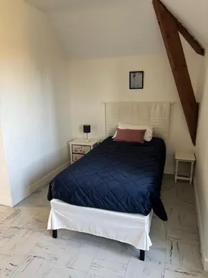 Un ou plusieurs lits dans un hébergement de l'établissement Gîte Calme & Accueillant -Près de Beauval