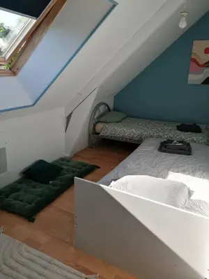 Un ou plusieurs lits dans un hébergement de l'établissement Chambres à louer à 10 minutes du Mans, dans la Sarthe