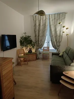 Télévision ou salle de divertissement dans l'établissement Agréable logement à Loches