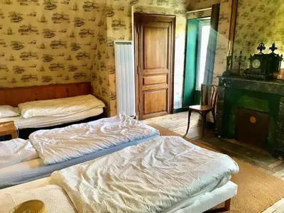 Un ou plusieurs lits dans un hébergement de l'établissement Grand Gite à Parcé Sur Sarthe