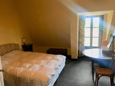 Un ou plusieurs lits dans un hébergement de l'établissement Grand Gite à Parcé Sur Sarthe