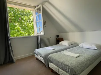 Un ou plusieurs lits dans un hébergement de l'établissement Villa de charme, 6 chambres, grand parc arboré