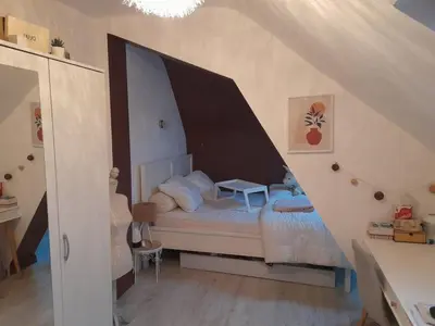 Un ou plusieurs lits dans un hébergement de l'établissement Chez Delphine et Bob -Ancienne Maison de Tanneurs