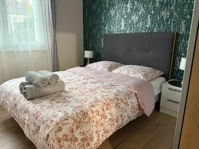 Un ou plusieurs lits dans un hébergement de l'établissement Liberte-Apartment with parking