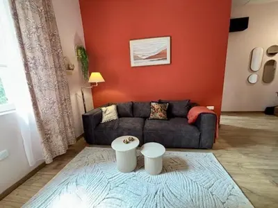 Coin salon dans l'établissement Le Dolby - 2 appartements communiquants avec parking privé 4 couchages