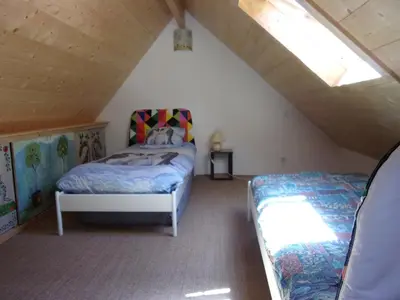 Un ou plusieurs lits dans un hébergement de l'établissement Maison Bois 