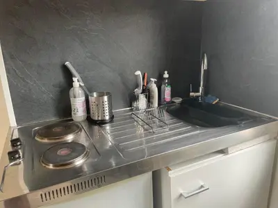 Cuisine ou kitchenette dans l'établissement Le Nid du Rempart Charmant Appt 2p TOURS centre