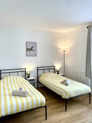 Un ou plusieurs lits dans un hébergement de l'établissement Le petit Parador