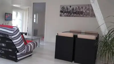 Un ou plusieurs lits dans un hébergement de l'établissement Appartement tout confort dans petit jardin calme