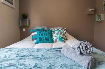 Un ou plusieurs lits dans un hébergement de l'établissement Studio Cosy La Fuye, proche gare, VELORA