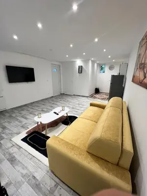 Télévision ou salle de divertissement dans l'établissement Grand studio tout équipé