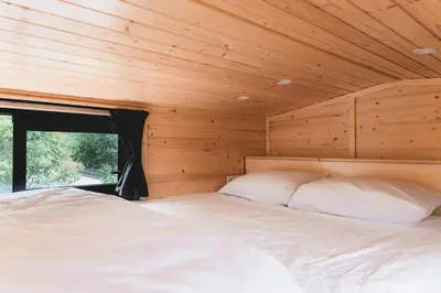 Un ou plusieurs lits dans un hébergement de l'établissement Charm House by Tiny Away