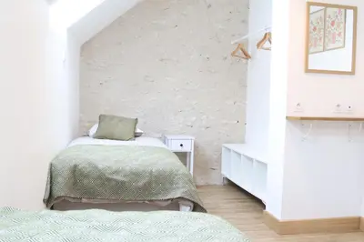 Un ou plusieurs lits dans un hébergement de l'établissement Gîte de L'Atelier