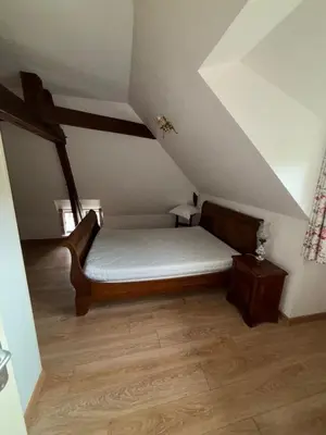 Un ou plusieurs lits dans un hébergement de l'établissement Manoir du Moulin