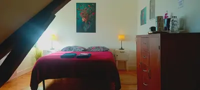 Un ou plusieurs lits dans un hébergement de l'établissement Chez ISA chambre chez l'habitant Léa