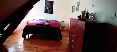 Un ou plusieurs lits dans un hébergement de l'établissement Chez ISA chambre chez l'habitant Léa